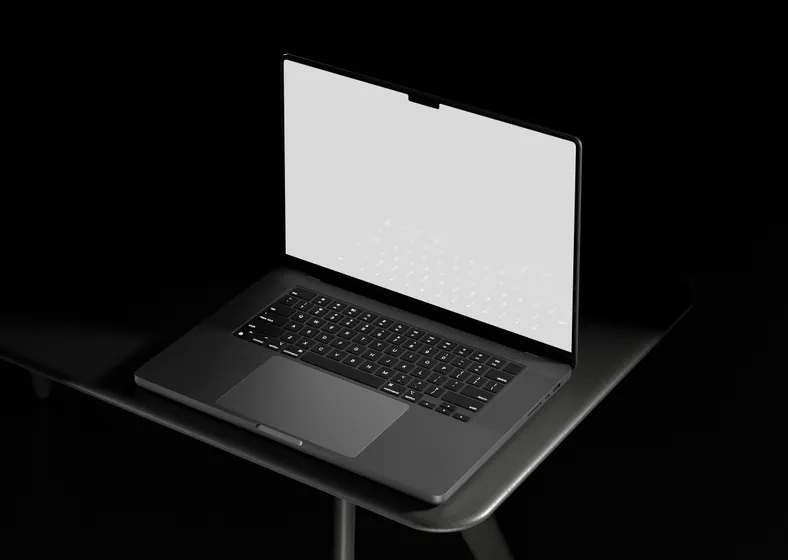 A laptop with a blank screen on a desk, awarded free to students joining the Integrated Degree programme.